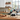 Wine rack with bottles on a kitchen counter with a window view