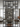metal floor to ceiling wine rack placed as a room divider