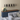 W Series Over the Couch Wine Rack Kit in Matte Black Storing 30 Bottles in a Living Room