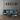 W Series Over the Couch Wine Rack Kit in Golden Bronze Black Storing 15 Bottles in a Living Room
